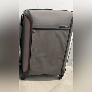 Tumi Gray and Black Travel Suitcases